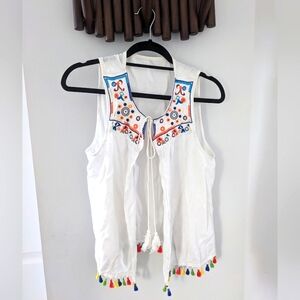 Festive blouse/vest with colourful tassels